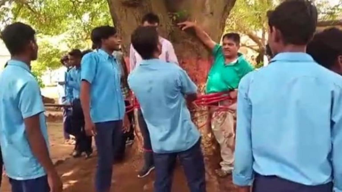 Jharkhand Math trainer, clerk tied to tree with rope, thrashed for giving poor marks
